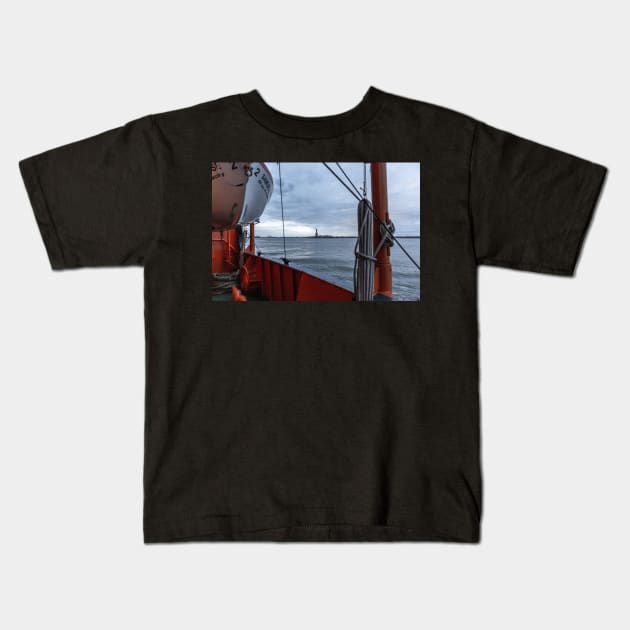 Liberty through the Staten Island Ferry Kids T-Shirt by ShootFirstNYC